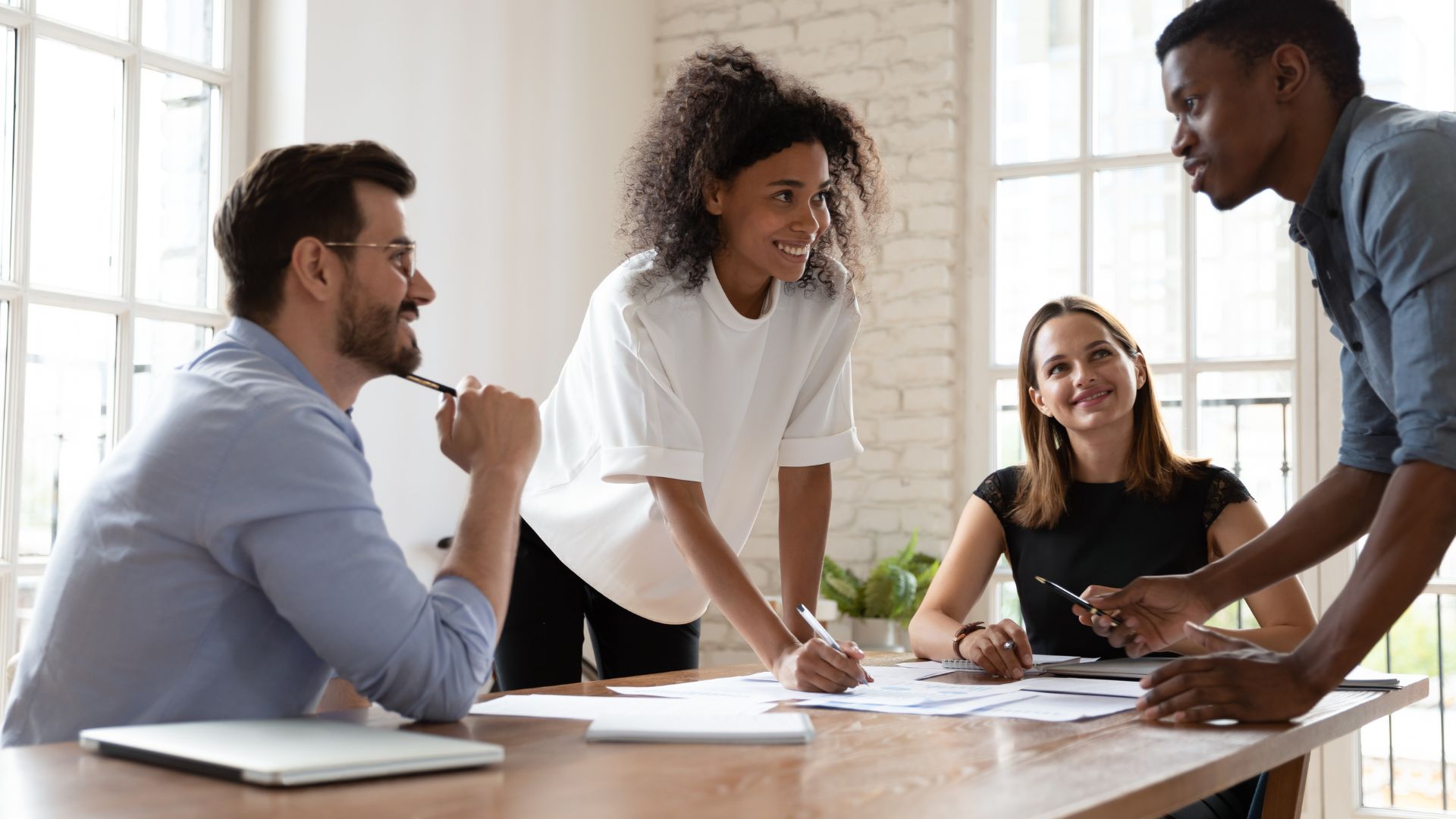 An outsourced team collaborating at work.